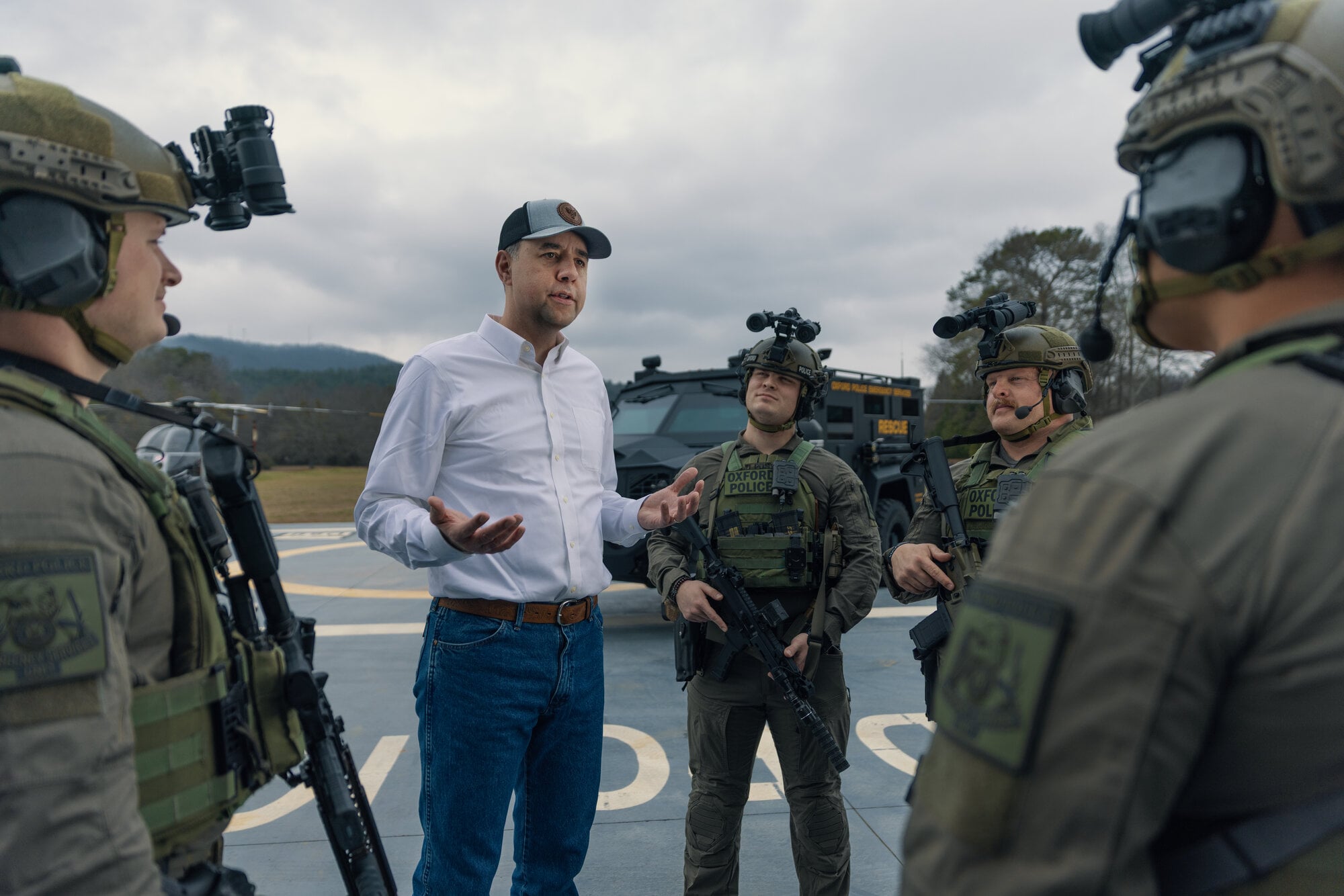 Jay Mitchell speaking with SWAT team members